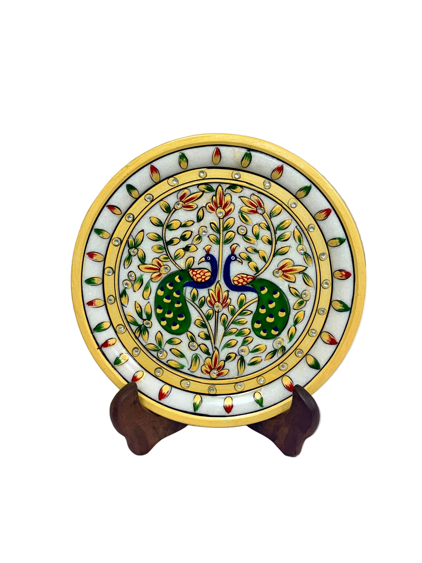 A round marble plate with hand-painted peacocks, floral motifs, and a yellow border, displayed on a small wooden stand against a neutral background.