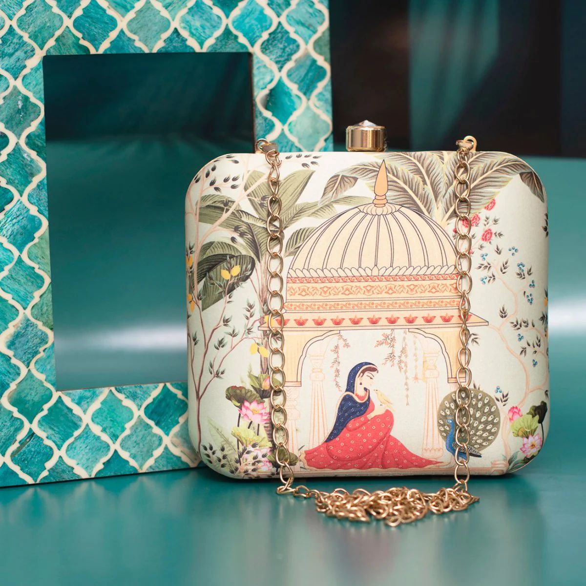 Designer Clutch with Women in Traditional Attire Sitting in a Domed Pavilion