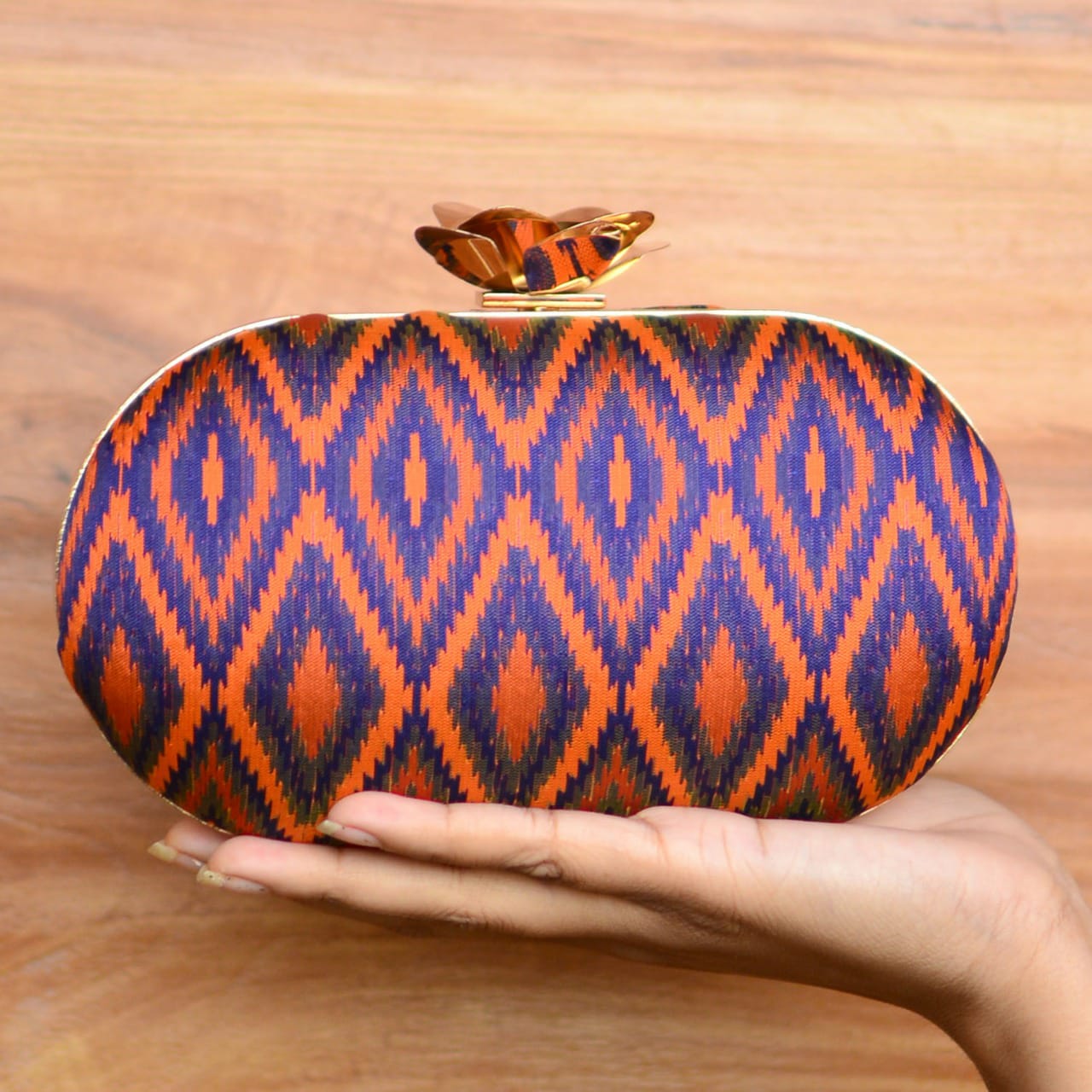 Geometric Pattern Fabric Cylindrical Shape Clutch with Designer Floral Knob