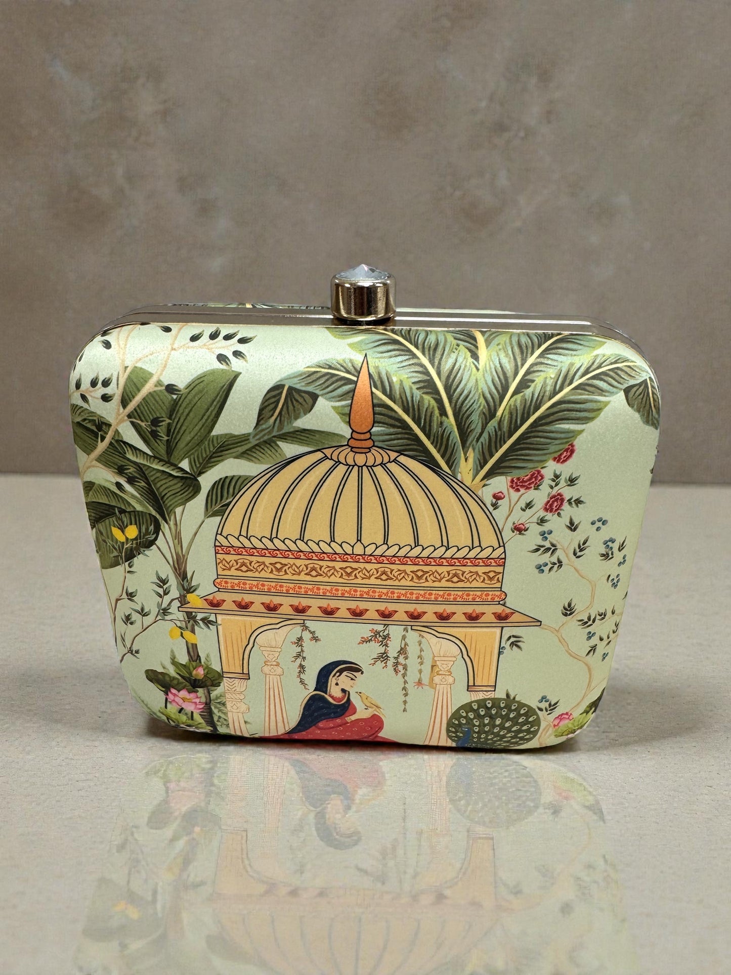 Designer Clutch with Women in Traditional Attire Sitting in a Domed Pavilion