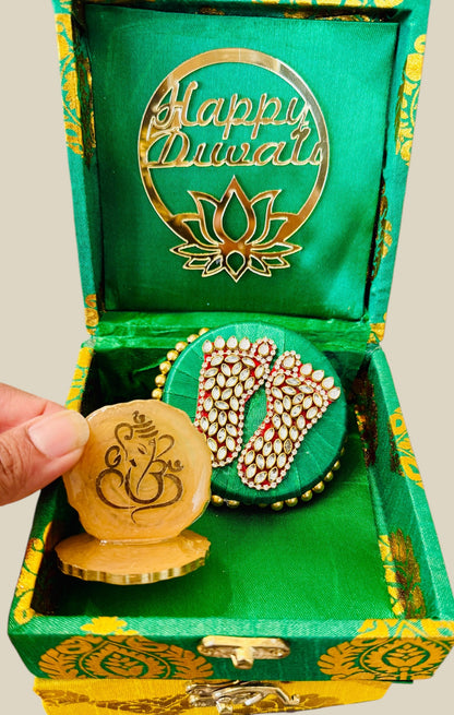 Decorative items with 'Happy Diwali' design in a green box.