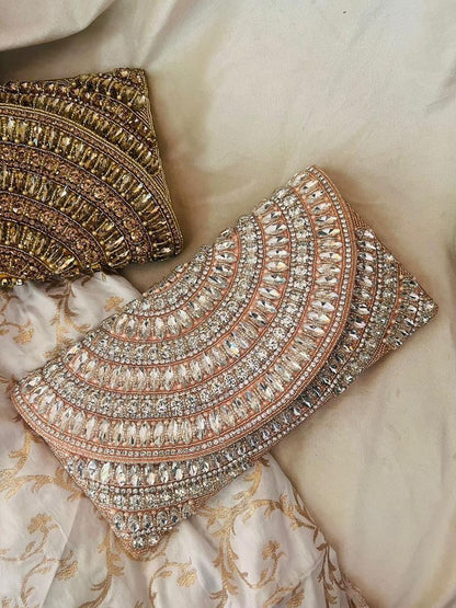 Decorative gold and silver embellishments on a textured fabric background
