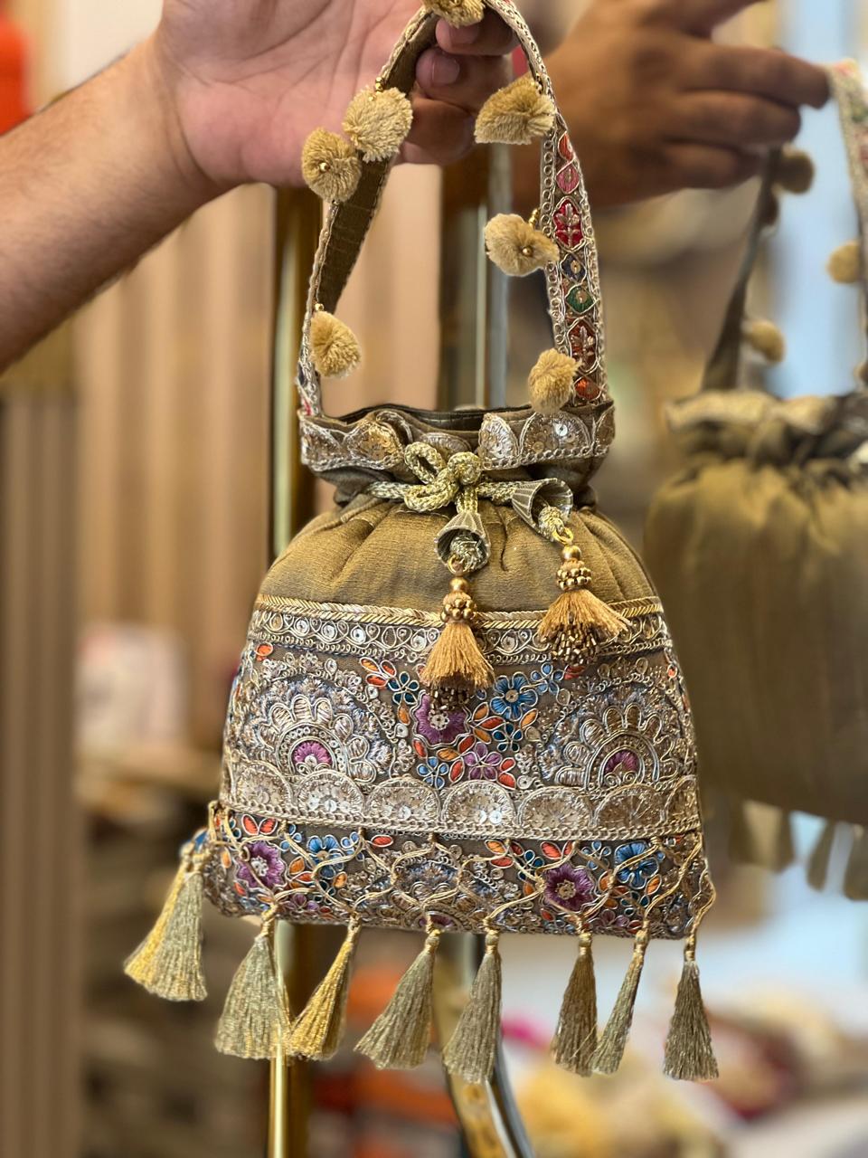 Silk Potli Bag with Hand Embroidery, Pom Pom & Tassels