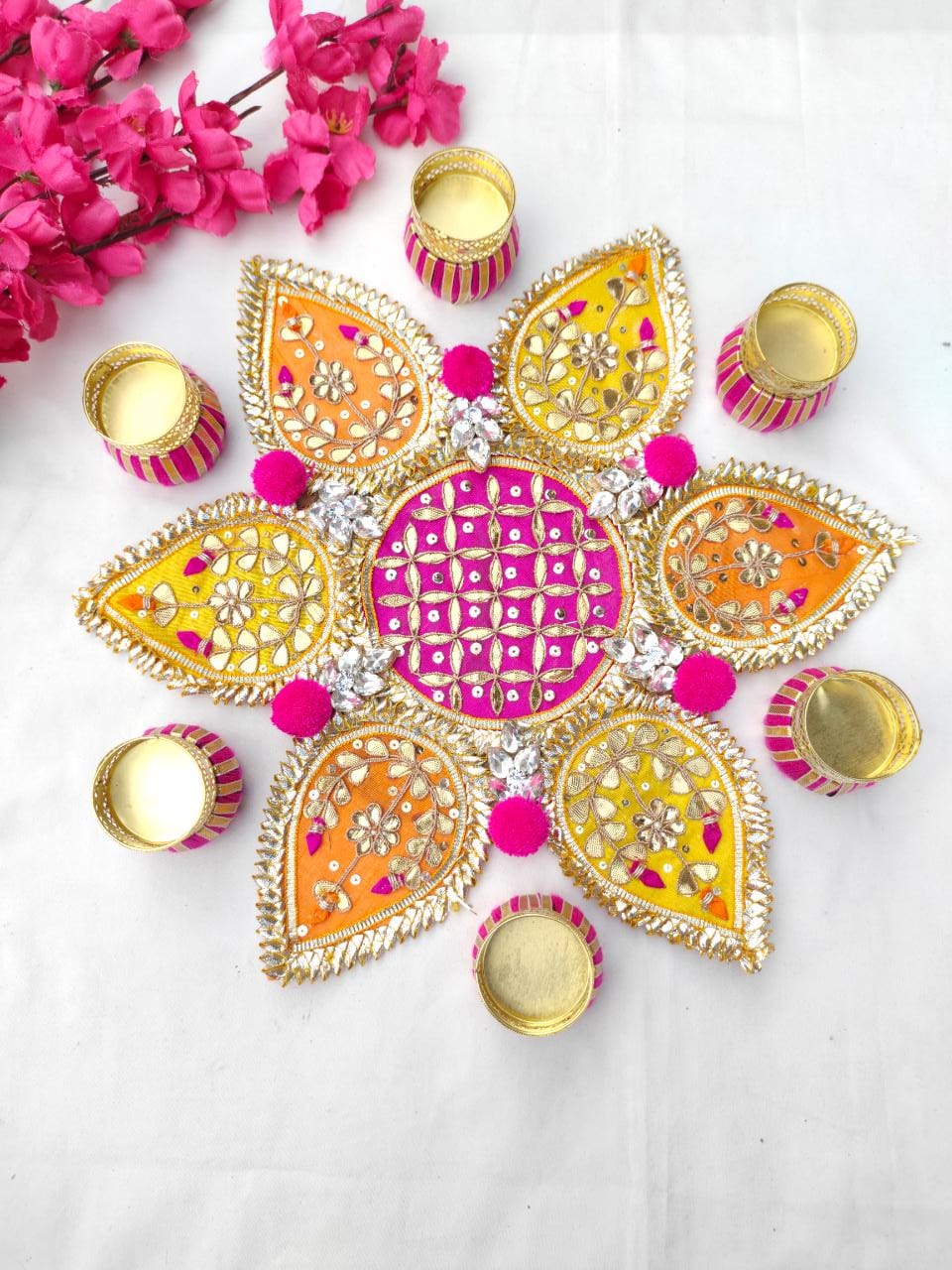 Decorative Diwali rangoli with colorful design on a white background