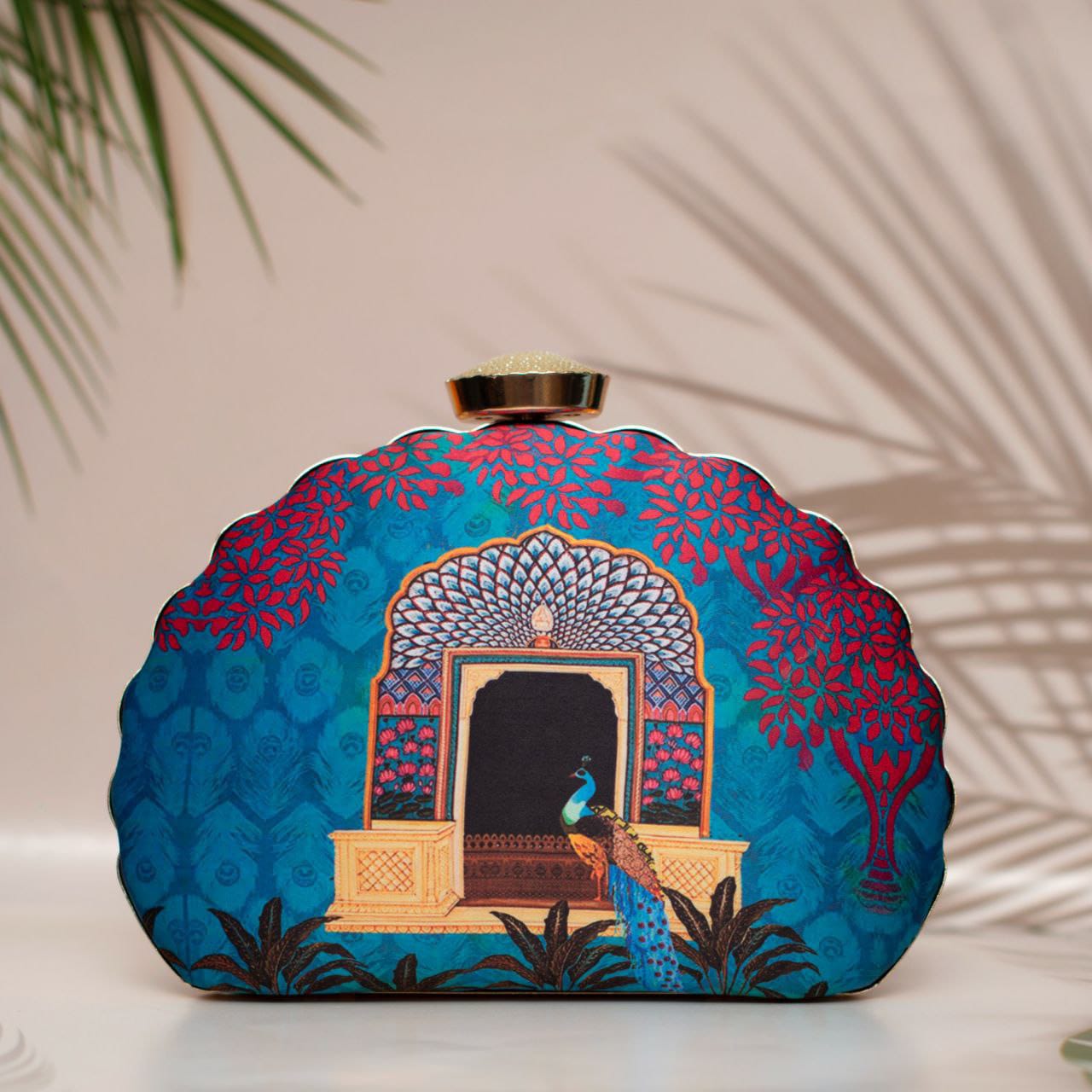 Designer Clutch with Peacock Standing in Front of an Ornate Arched Doorway
