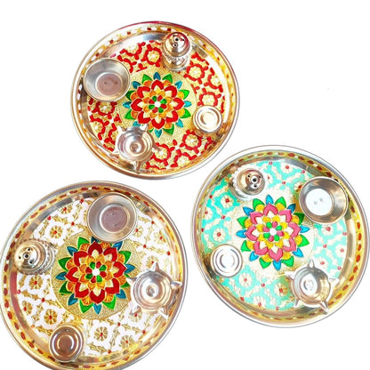 Three decorative plates with floral designs on a white background
