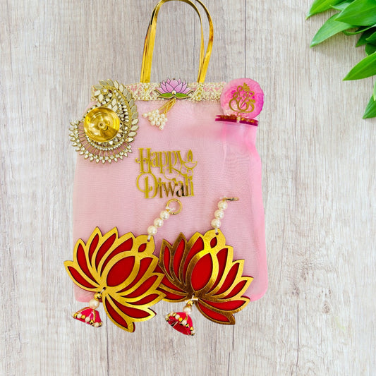 Combo of Akhand Diya, Resin Ganesha, Lotus Hanging in Organza Bag